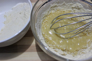 Mixing flour mixture in batches with the wet mixture 